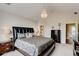Spacious main bedroom with decorative lighting and neutral paint at 133 Parkway Dr, Fairburn, GA 30213