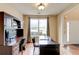 Well-appointed office with dark wood furniture, including a built-in desk and ample natural light at 133 Parkway Dr, Fairburn, GA 30213
