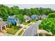 Street view of charming homes with manicured lawns and mature trees at 133 Parkway Dr, Fairburn, GA 30213