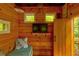 Cozy treehouse interior with wood paneling, TV, and comfortable seating at 133 Parkway Dr, Fairburn, GA 30213