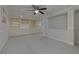 Finished basement with built-in cabinets and shelves in a versatile space with a ceiling fan at 2995 Aspen Ridge Ct, Snellville, GA 30078