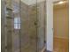 Modern bathroom featuring a tiled walk-in shower with glass door and overhead shower head at 2995 Aspen Ridge Ct, Snellville, GA 30078