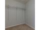 Walk-in closet with adjustable shelving for custom organization at 2995 Aspen Ridge Ct, Snellville, GA 30078