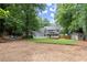 Lush backyard featuring a screened porch, detached building, and a spacious lawn at 4504 Reva Ne Way, Marietta, GA 30066