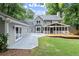 Expansive backyard with a large deck, screened porch, detached building, and ample green space at 4504 Reva Ne Way, Marietta, GA 30066