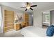 Comfortable bedroom featuring built-in shelves, a desk, and closet at 4504 Reva Ne Way, Marietta, GA 30066