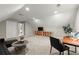Spacious bonus room with a small sofa, a desk, a potted plant, and a media center at 4504 Reva Ne Way, Marietta, GA 30066