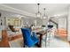 Open-concept dining room with hardwood floors, stylish lighting and a large picture window at 4504 Reva Ne Way, Marietta, GA 30066