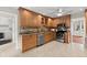 Traditional kitchen with stainless appliances, granite counters, and adjacent laundry room at 4504 Reva Ne Way, Marietta, GA 30066