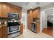 Well-lit kitchen with stainless steel appliances, ample cabinetry, and granite countertops at 4504 Reva Ne Way, Marietta, GA 30066