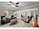 Bright open-plan living room with hardwood floors and a view into the dining area at 4504 Reva Ne Way, Marietta, GA 30066