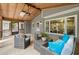 Charming screened-in porch with wicker seating and views of the backyard at 4504 Reva Ne Way, Marietta, GA 30066