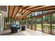 Inviting screened porch with a wooden ceiling, wicker furniture, and views of the backyard at 4504 Reva Ne Way, Marietta, GA 30066