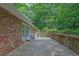 Wide wooden deck with brick siding overlooking a lush backyard at 1981 Bramblewood Ne Dr, Brookhaven, GA 30329