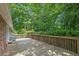 Spacious wooden deck with brick siding overlooking a lush backyard at 1981 Bramblewood Ne Dr, Brookhaven, GA 30329