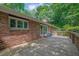 Wide wooden deck with brick siding overlooking a lush backyard at 1981 Bramblewood Ne Dr, Brookhaven, GA 30329