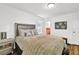 Comfortable bedroom featuring plush bedding, decorative pillows and natural lighting at 1981 Bramblewood Ne Dr, Brookhaven, GA 30329
