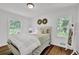 Comfortable bedroom featuring hardwood floors and lots of natural light at 1981 Bramblewood Ne Dr, Brookhaven, GA 30329