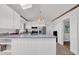 Bright kitchen with stainless appliances, granite countertops, and stylish modern lighting at 1981 Bramblewood Ne Dr, Brookhaven, GA 30329