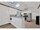Bright kitchen features white cabinets, stainless steel appliances, skylights, and granite countertops at 1981 Bramblewood Ne Dr, Brookhaven, GA 30329