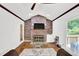 Comfortable living room area with a brick fireplace, hardwood floors and backyard access at 1981 Bramblewood Ne Dr, Brookhaven, GA 30329