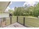 Deck with fenced yard and wooded backdrop at 218 Ward Rd, Ellenwood, GA 30294