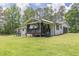 Home exterior showing a deck and screened porch at 218 Ward Rd, Ellenwood, GA 30294