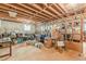 This unfinished basement has exposed beams, a small window, and is full of storage options at 218 Ward Rd, Ellenwood, GA 30294