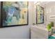 This bathroom features modern decor and an interesting framed mirror above the sink at 218 Ward Rd, Ellenwood, GA 30294