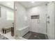 Modern bathroom featuring a glass enclosed shower with white marble tiling and a built in bench at 218 Ward Rd, Ellenwood, GA 30294