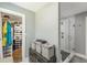A bathroom includes a glass door shower, fresh towels, and access to the walk-in closet at 218 Ward Rd, Ellenwood, GA 30294