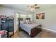Comfortable bedroom featuring a bay window, ceiling fan, and ample space for relaxation and personalization at 218 Ward Rd, Ellenwood, GA 30294