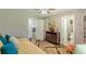 Bedroom featuring a daybed, desk, dresser, and dual bathroom access at 218 Ward Rd, Ellenwood, GA 30294