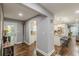 Welcoming entryway leading to the kitchen with hardwood floors and modern finishes at 218 Ward Rd, Ellenwood, GA 30294
