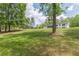 Home exterior surrounded by large green lawn at 218 Ward Rd, Ellenwood, GA 30294