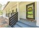 Close-up of a front porch showing a welcoming entrance with decorative touches and curb appeal at 218 Ward Rd, Ellenwood, GA 30294