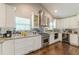 Bright kitchen with stainless steel appliances, granite counters, mirrored backsplash and plenty of storage at 218 Ward Rd, Ellenwood, GA 30294