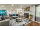 Inviting living room featuring a fireplace, modern furniture, and hardwood floors at 218 Ward Rd, Ellenwood, GA 30294