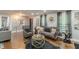 The hardwood floored living room has eye-catching decor and a relaxing vibe at 218 Ward Rd, Ellenwood, GA 30294