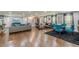 Open living room with a dining area, stylish decor, and hardwood floors at 218 Ward Rd, Ellenwood, GA 30294