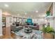 Spacious living room featuring modern decor, hardwood floors, and recessed lighting at 218 Ward Rd, Ellenwood, GA 30294