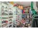 This organized walk-in closet includes many different storage solutions for shoes and clothing at 218 Ward Rd, Ellenwood, GA 30294