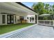 Spacious backyard featuring a covered patio, outdoor kitchen and hot tub at 2912 Vinings Forest Se Way, Atlanta, GA 30339
