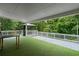 Expansive backyard with covered patio, hot tub, and tree coverage for privacy at 2912 Vinings Forest Se Way, Atlanta, GA 30339
