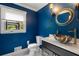 Stylish powder room with blue accent wall and designer bowl sink at 2912 Vinings Forest Se Way, Atlanta, GA 30339