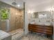 A beautifully designed bathroom with a glass shower, dual vessel sinks, and contemporary vanity at 2912 Vinings Forest Se Way, Atlanta, GA 30339