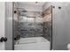 Elegant bathroom with a luxurious tiled tub, decorative tile accents, and modern fixtures at 2912 Vinings Forest Se Way, Atlanta, GA 30339