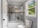Well-lit bathroom with tiled shower and glass door, plus a large window at 2912 Vinings Forest Se Way, Atlanta, GA 30339
