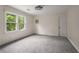 Bright bedroom featuring large windows with natural light and neutral carpeting at 2912 Vinings Forest Se Way, Atlanta, GA 30339