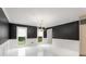 Modern dining room featuring dark accent wall and chandelier lighting at 2912 Vinings Forest Se Way, Atlanta, GA 30339